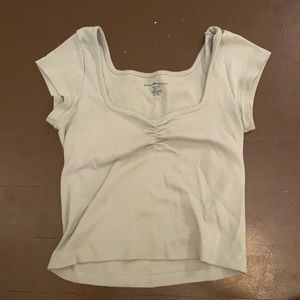 brandy light green top